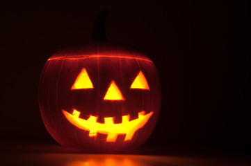 Halloween pumpkin glowing in the dark