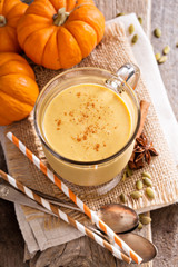 Fototapeta na wymiar Healthy pumpkin smoothie in big mugs
