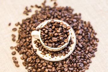 roasted coffee beans with cup