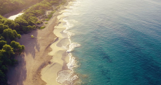 Stunning Aerial Flight Over White Sandy Beach and Beautiful Blue Ocean. 