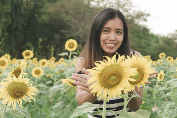 Beautiful woman and sunflower - Vintage Filter Effect