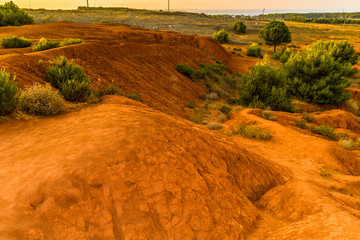 red soils around the lake in bauxite quarry