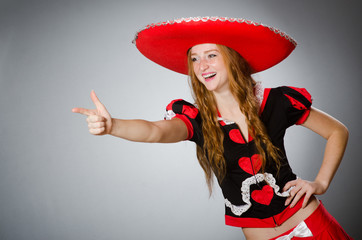 Mexican woman wearing sombrero hat