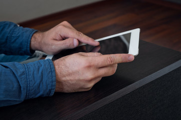 Man working with a tablet computer at home