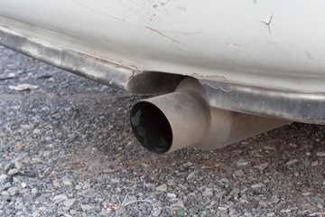 White tailpipes of cars, while the engine is off.
