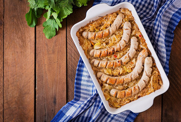 Munich sausages with fried cabbage. Top view