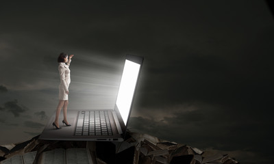 Fototapeta premium Woman in light of laptop screen
