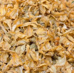 Heap of crispy fried fish in the market.