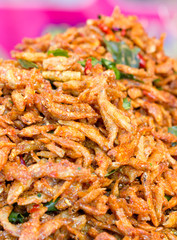 Heap of crispy fried fish in the market.