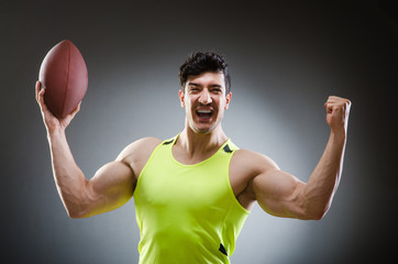 Muscular man with american football