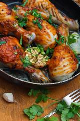 fried chicken drumsticks in a frying pan
