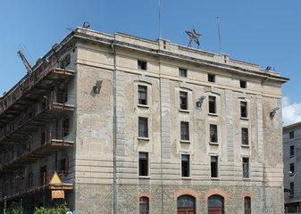 Fototapeta premium Abandoned buildings in old harbor in Trieste, Italy