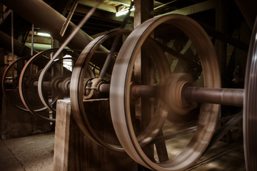 old heavy machine wheel working by hot steam in ancient traditio