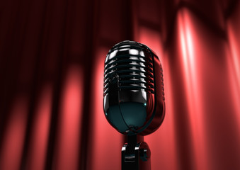 Vintage microphone on stage with red curtains. Moody stage light
