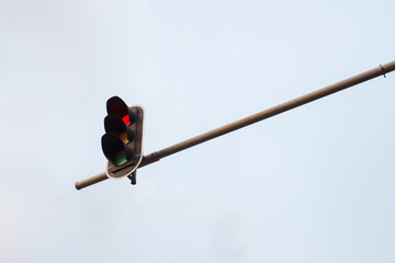 Traffic light with sky background.