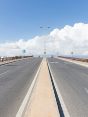 An asphalt road goes to horizon