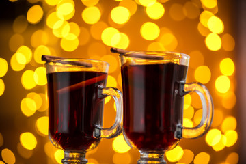 Christmas hot mulled wine with spices on a wooden table. The idea for creating greeting cards