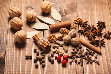 Collection of spices for mulled wine and pastry on the wooden table