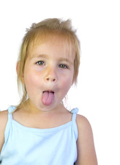 Portrait of beautiful little girl showing her tongue