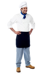 Young confident male chef posing