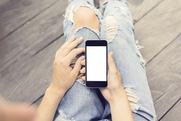 Hipster girl with blank cell phone, mock up