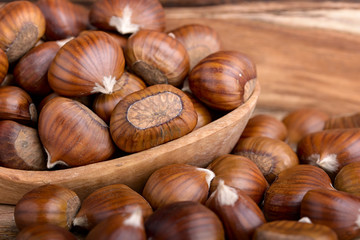pile of chestnuts in a wooden bowl