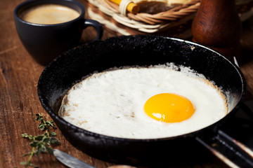 Breakfast setting with fried egg and coffee