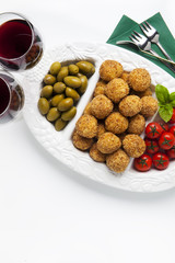 healthy italian appetizer with risotto balls arancini , green ol