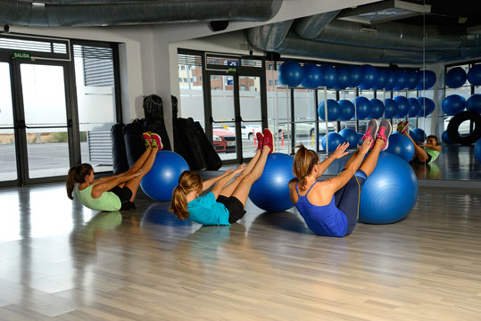Young women exercising in a gym.