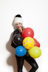 Fototapeta na wymiar winter girl with balloons