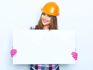 Woman worker builder hold big sign board against white backgrou