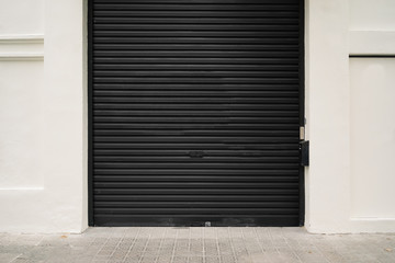 Roller garage door in black. Horizontal and empty
