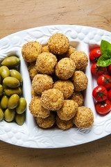 Healthy Italian Appetizer with Risotto Balls Arancini , green Ol