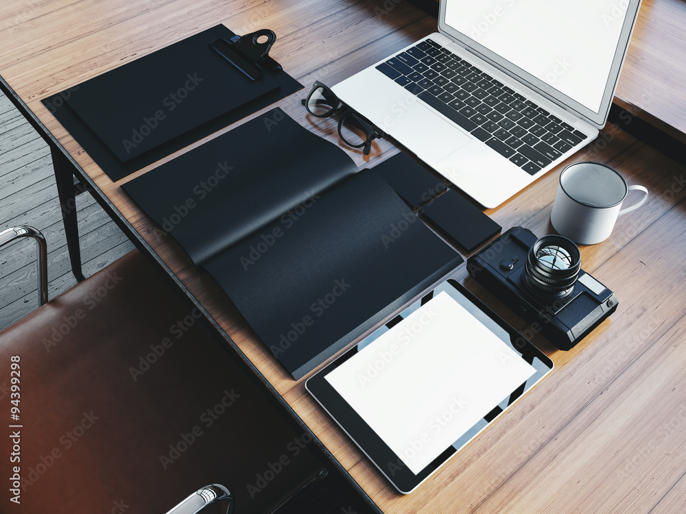 Aufkleber set of generic design laptop on the wooden table and office elements. 3d rendering