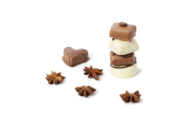 Chocolate candies tower on white