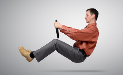 Businessman car driver with a steering wheel