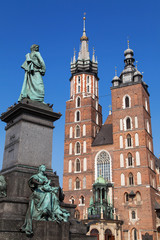 Fototapeta na wymiar Adam Mickiewicz statue and Saint Mary Basilica