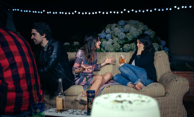Woman talking with bored female friend in a party