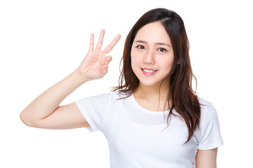 Asian young woman showing ok sign gesture