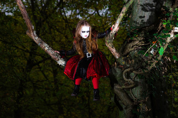 Cute little girl dressed in Halloween costume