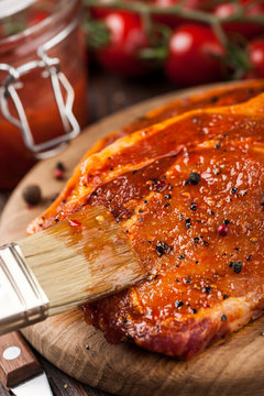 Marinated pork steak on cutting board