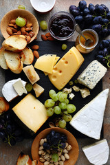 various cheeses and grapes