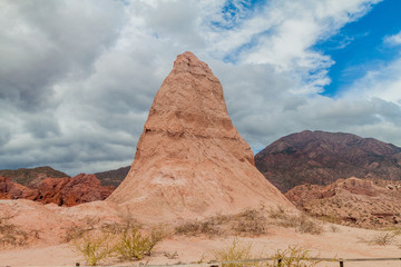 Fototapeta na wymiar Rock formation called Obelisco in Quebrada de Cafayate, Argentina. National park Quebrada de las Conchas.