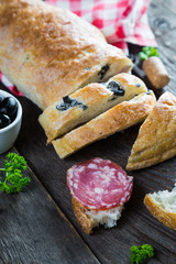 Bread with black olives salami, Italian snacks
