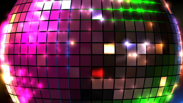 A closeup of a colorful reflective disco mirrorball with glinting highlights spinning slowly on a blurry colored background