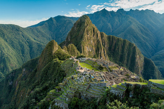 Aerial view of famous Mach Picchu ruins, Wayna Picchu mountain in the bacground.