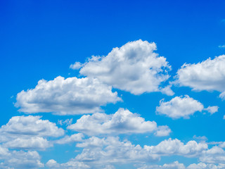 Blue sky background with white clouds on the bright day summer.