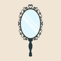 vintage mirror with a handleon a background