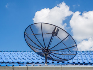 Satellite dish transmission data on blue sky background.Satellite dish communication technology network.