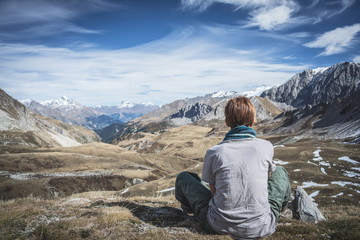 Naklejka premium Woman resting on the mountain summit
